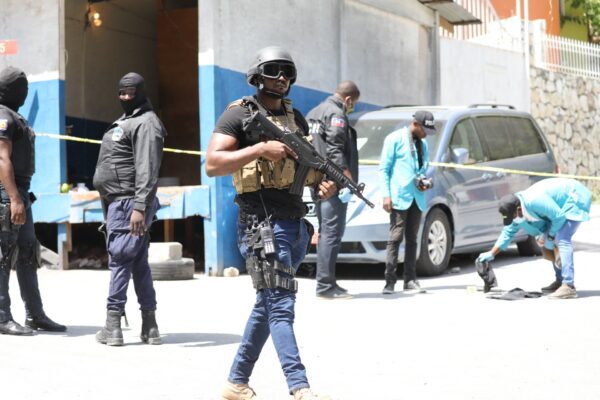 Haitian police and forensic members