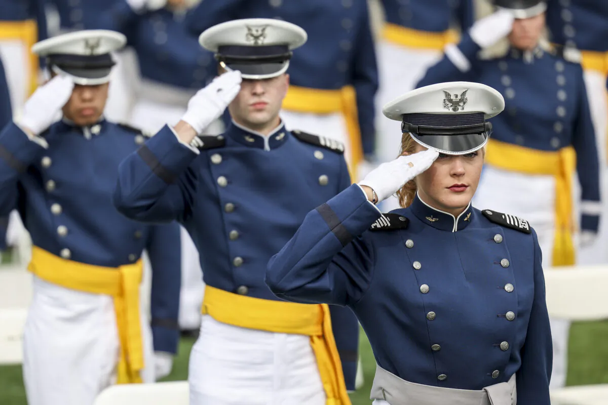 Members of the U.S. Air Force Academy Class of 2021 salute during their graduation ceremony at Falcon Stadium in Colorado Springs, Colorado, on May 26, 2021. (Michael Ciaglo/Getty Images)