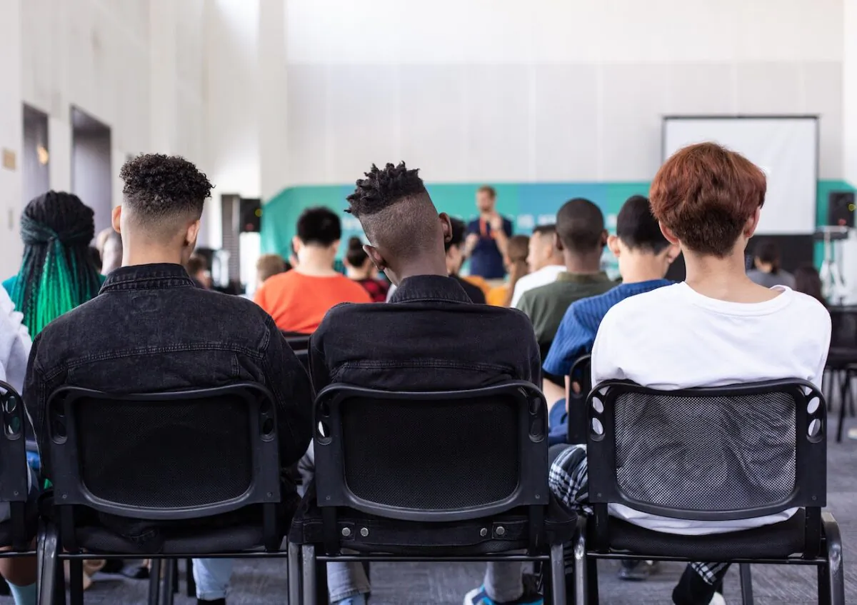 Illustration image shows children receiving instruction at a school. (Sam Balye/Unsplash)