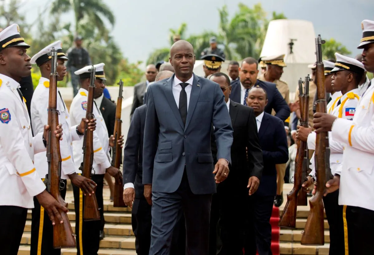  Haiti's President Jovenel Moise (C) leaves the museum during a ceremony marking the 215th anniversary of revolutionary hero Toussaint Louverture's death, at the National Pantheon museum in Port-au-Prince, Haiti, on April 7, 2018. (Dieu Nalio Chery/File/AP Photo)