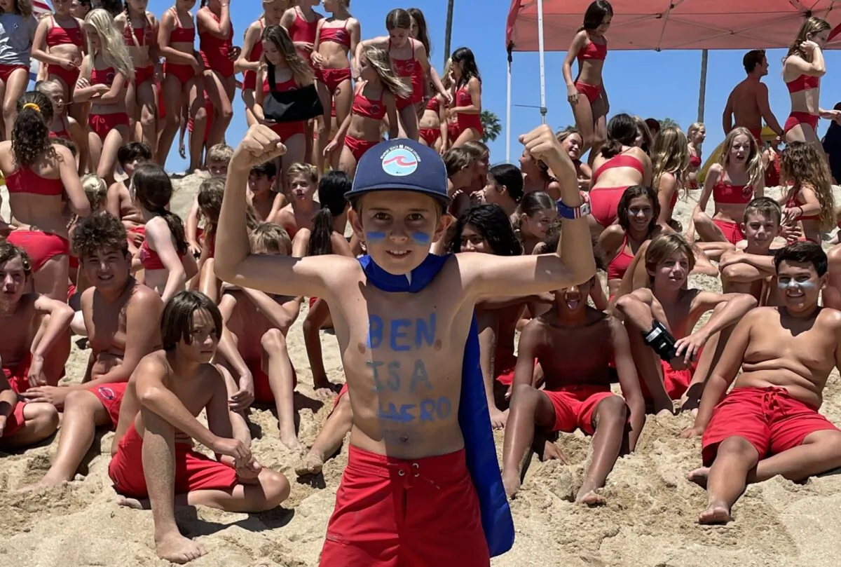 “Ben is a Hero” enthusiast and Newport Beach junior lifeguard Dylan Gabriele with fellow junior lifeguard participants during the July 6 Ben Carlson Day in Newport Beach, Calif. Carlson died July 6, 2014, while attempting to save a distressed swimmer. (Courtesy of Jake Janz)