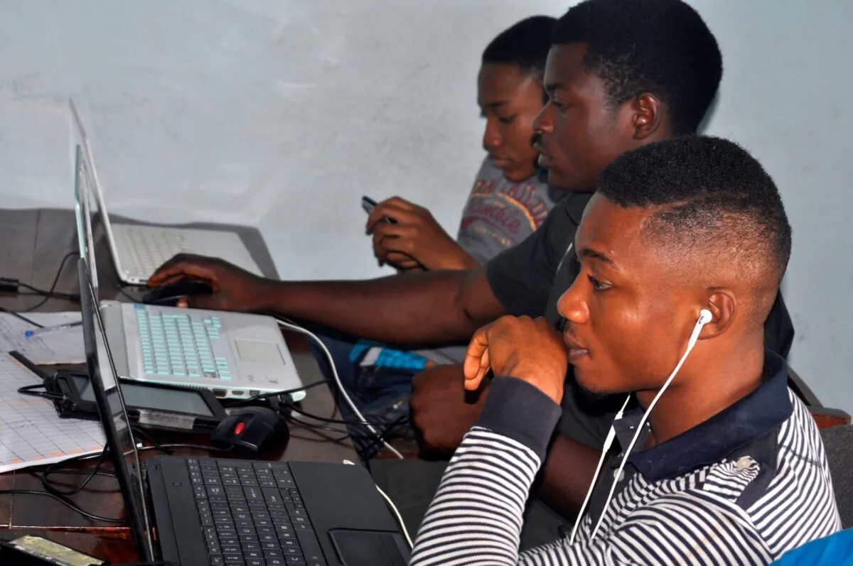 Men work during a session on technological innovation in a start-ups incubator ActivSpaces in Buea on Sep. 24, 2019. (Reinnier Kaze/AFP via Getty Images)