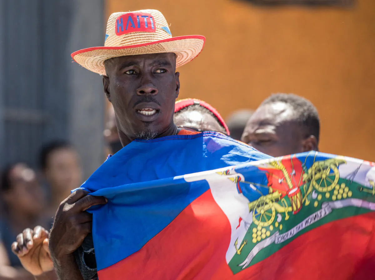 Haitians demonstrate during a protest to denounce the draft constitutional referendum carried by the President Jovenel Moise in Port-au-Prince on March 28, 2021. (Valerie Baeriswyl/AFP via Getty Images)