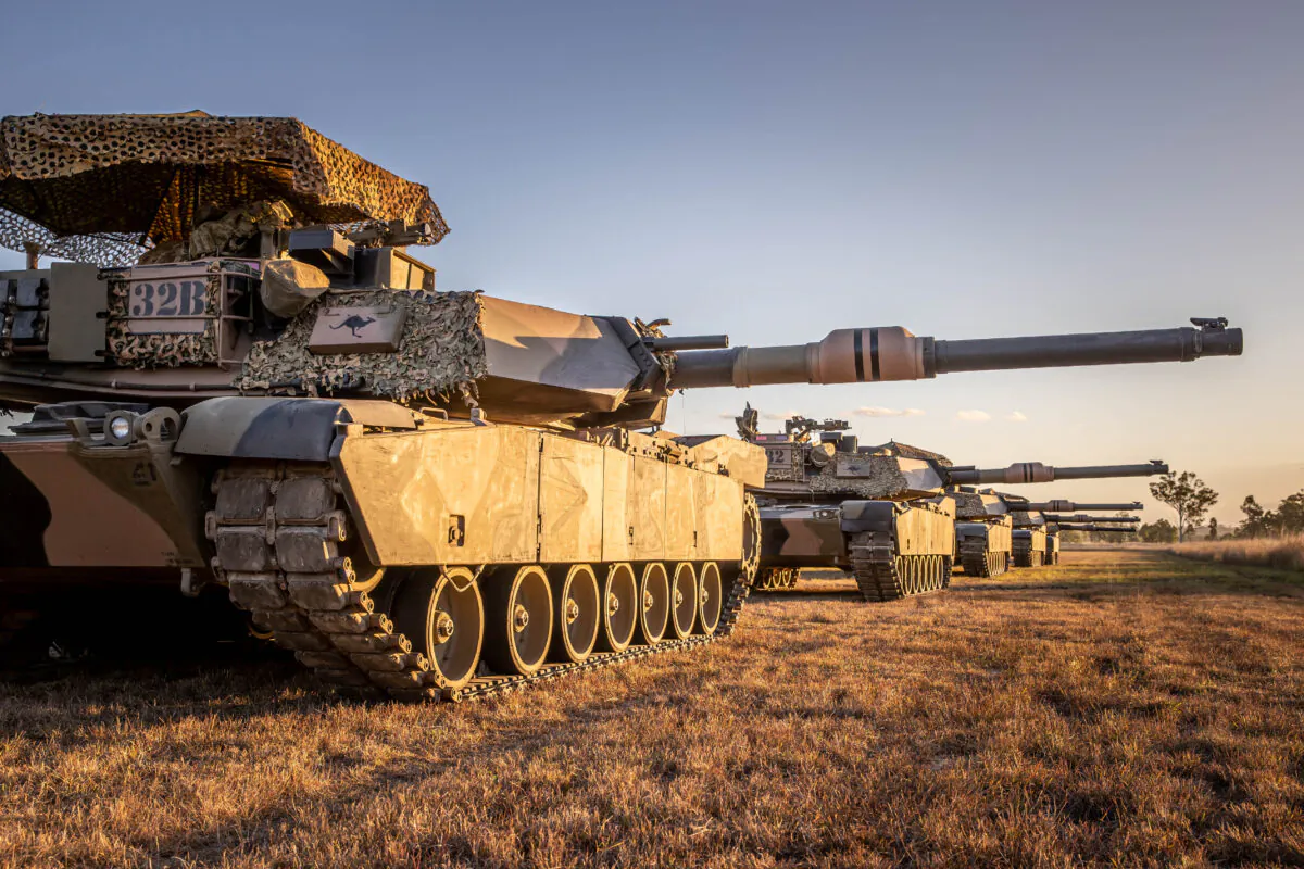 Five Australian Army M1A1 Abrams tanks from the 2nd/14th Light Horse Regiment (Queensland Mounted Infantry) cast long shadows during Exercise Diamond Catalyst at Shoalwater Bay Training Area, Queensland. (TPR Jonathan Goedhart/ADF)