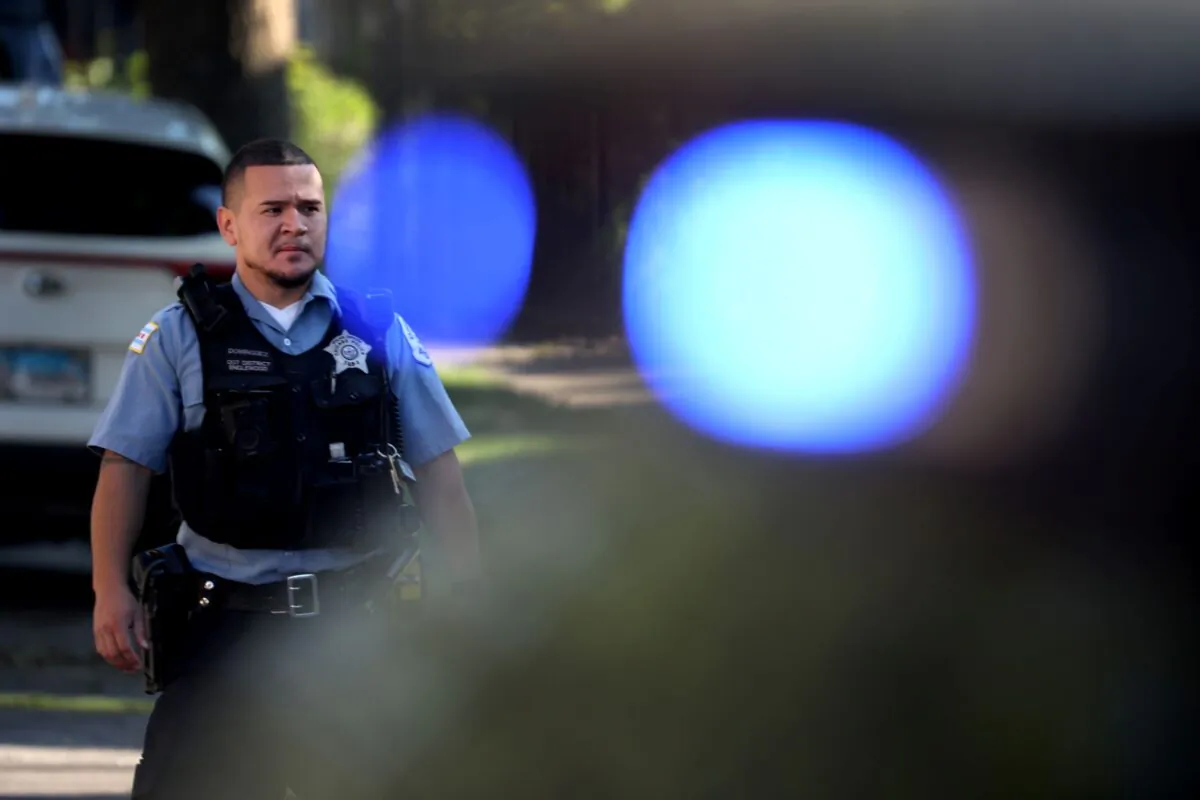 A Chicago police officer at a shooting scene in the Englewood neighborhood of Chicago on June 15, 2021.  (Scott Olson/Getty Images)