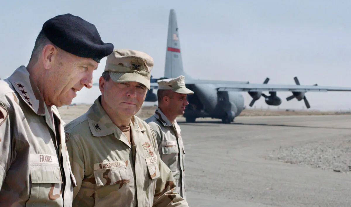 U.S. Commander of Central Command, Gen. Tommy Franks (L) is greeted by Task Force Rakkasan Commander Col. Francis Wiercinski (C) on May 15, 2002 at Kandahar airbase in southern Afghanistan. Franks stopped at the base to personally address the troops deployed there as part of Operation Enduring Freedom. (Scott Nelson/Getty Images)