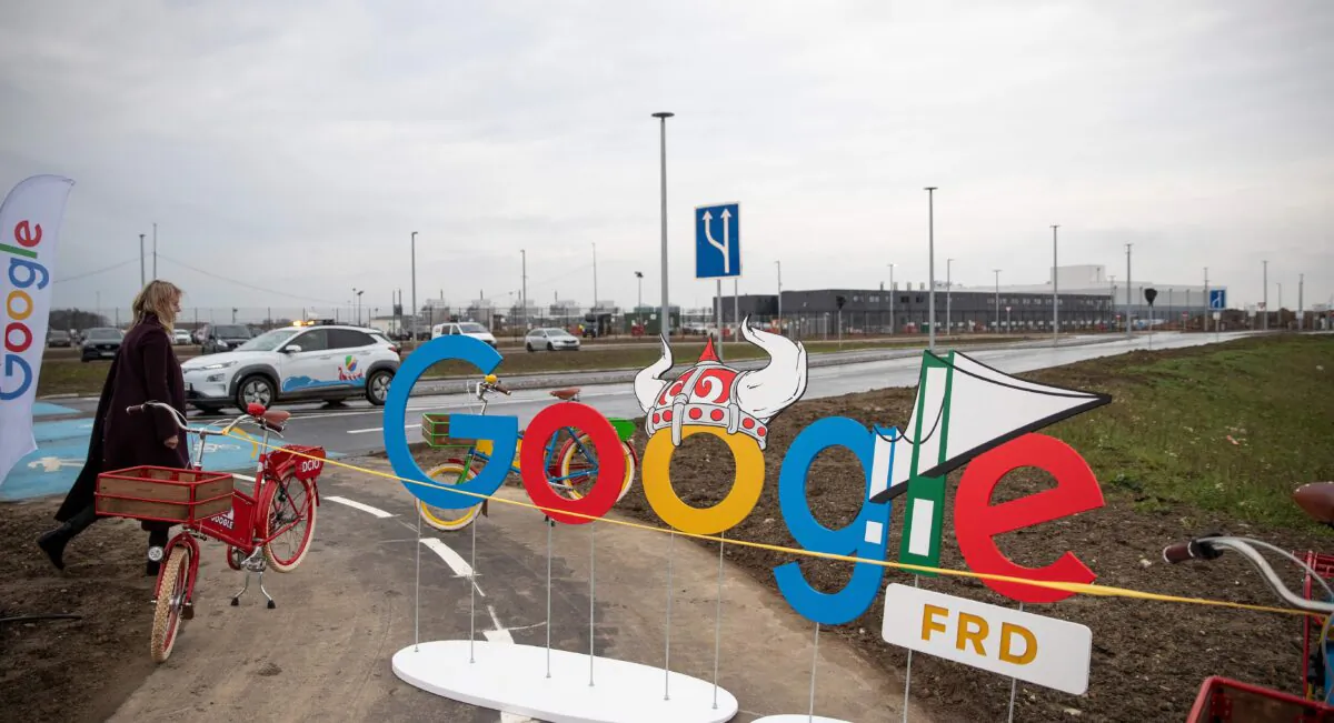 A woman passes by a google-themed barrier in front of a Google data center in Fredericia, Denmark, on Nov. 30, 2020. (Frank Cilius/Ritzau Scanpix/AFP via Getty Images)