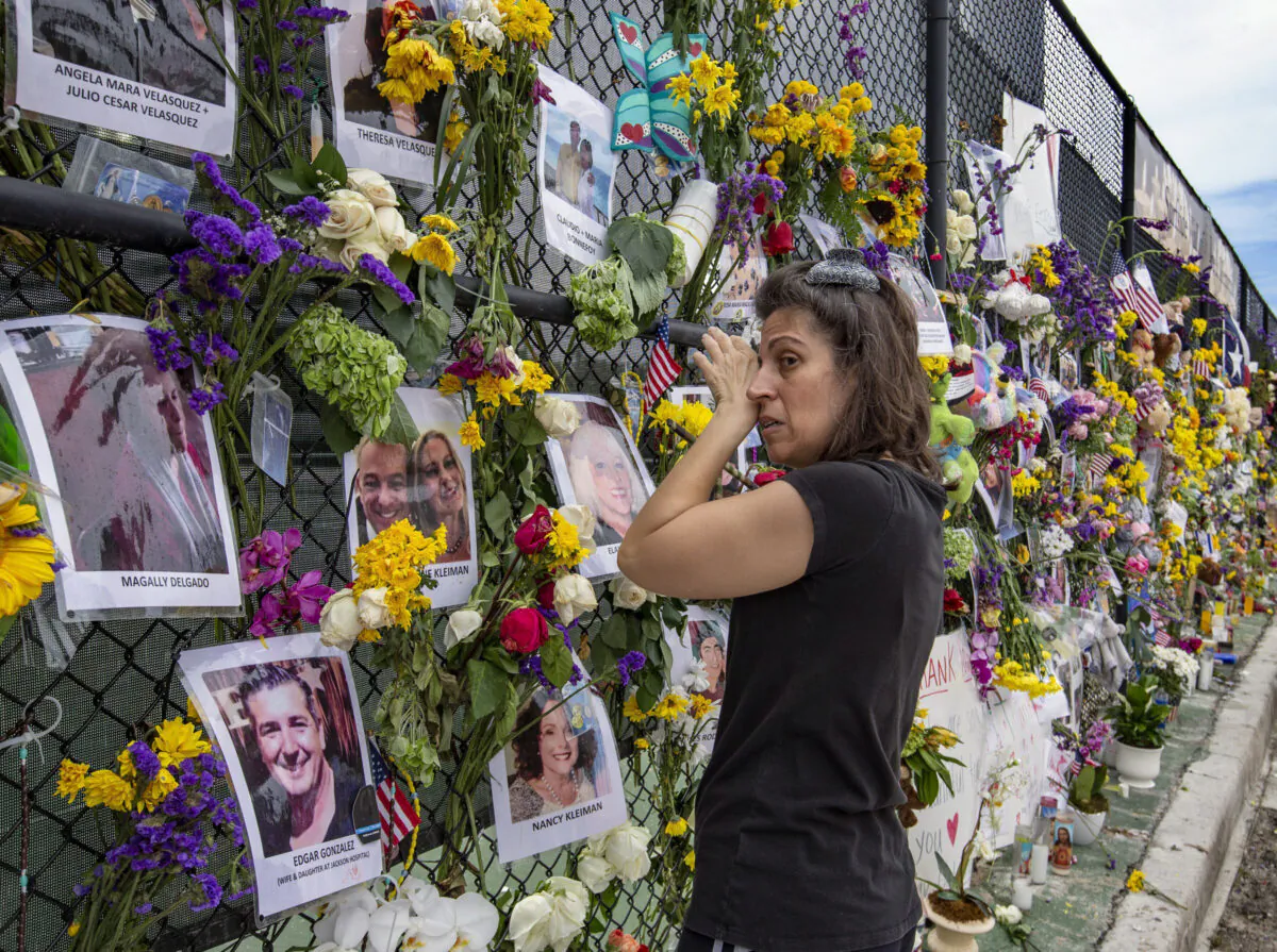 Gini Gonte visits the Surfside Wall of Hope  Memorial in Florida on July 7, 2021 (Al Diaz/Miami Herald via AP)