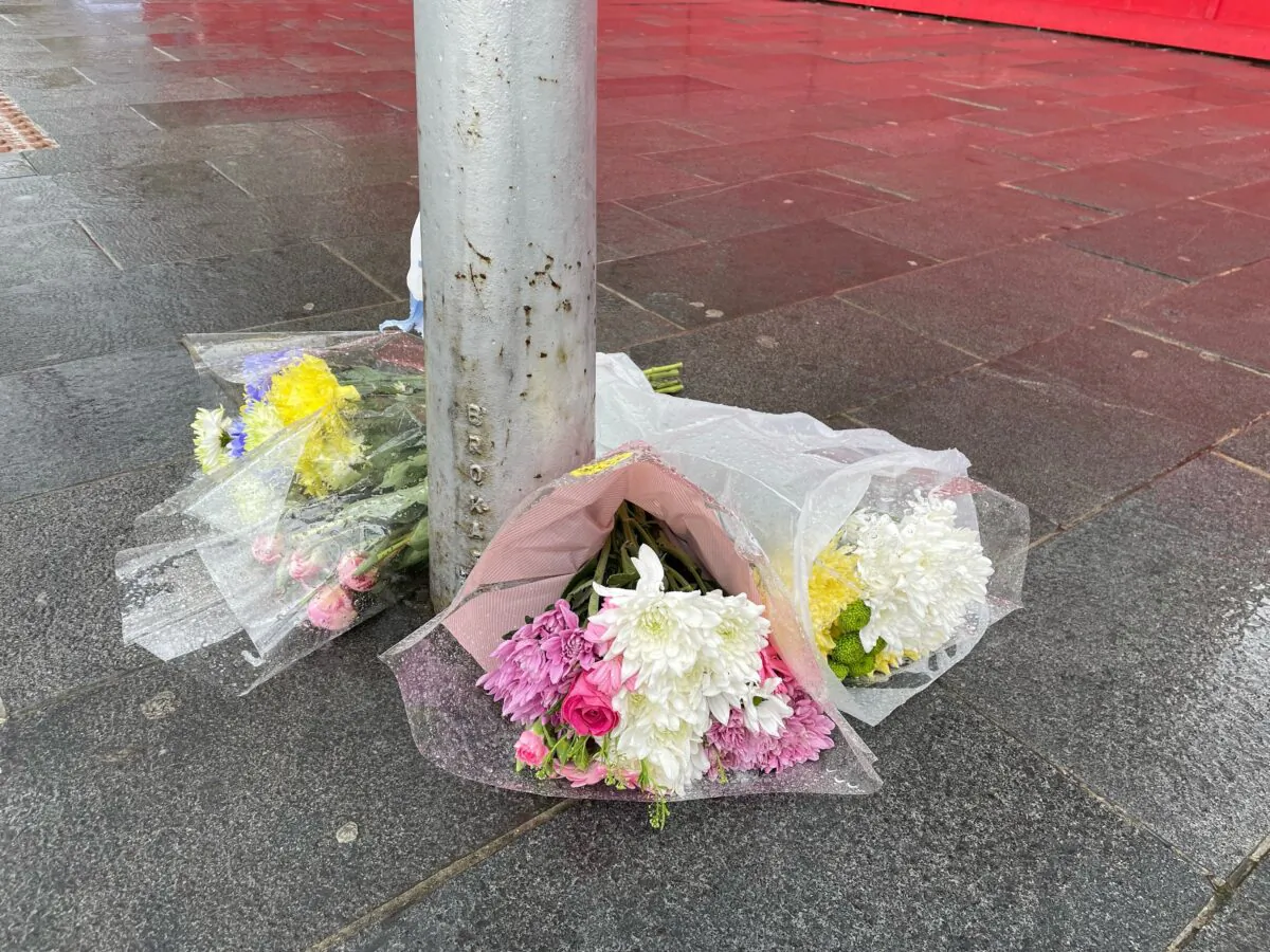 Flowers left near the scene at Woolwich New Road, Greenwich, where a 15-year-old boy was stabbed to death on Monday evening, in London, UK, on July 6, 2021. (Danielle Desouza/PA)