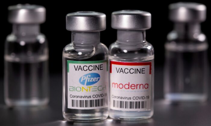 Vials with Pfizer-BioNTech and Moderna coronavirus disease (COVID-19) vaccine labels are seen in this illustration picture. (Dado Ruvic/Illustration/Reuters)