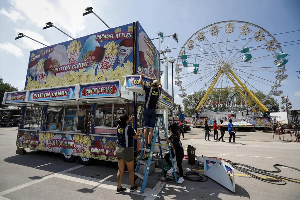 Stampede officials announced details of this year's event as preparations continue on the Stampede grounds in Calgary, on July 6, 2021. (The Canadian Press/Jeff McIntosh)