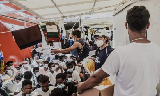 Hundreds of Rescued Migrants Disembark in Southern Italy