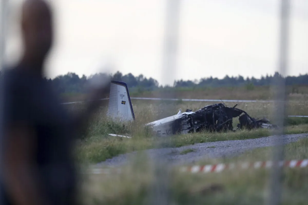 Emergency services at the scene of small aircraft crash, at Orebro Airport in Sweden, on July 8 2021. (Jeppe Gustafsson/TT News Agency via AP)