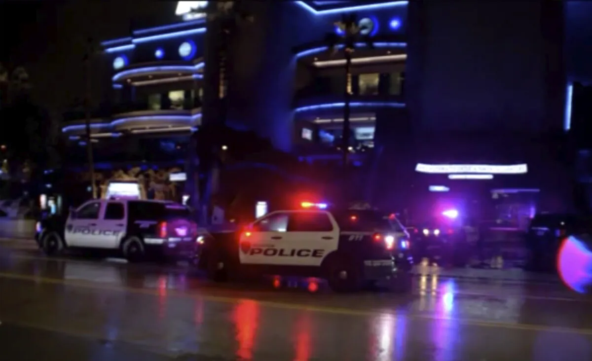 Police vehicles park outside the scene of a restaurant shooting Thursday, July 8, 2021, in Houston, Texas.(KTRK via AP)