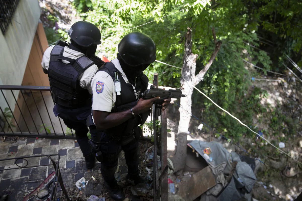 Police search the Morne Calvaire district of Petion Ville for suspects who remain at large in the murder of Haitian President Jovenel Moise in Port-au-Prince, Haiti, on July 9, 2021. (Joseph Odelyn/AP Photo)