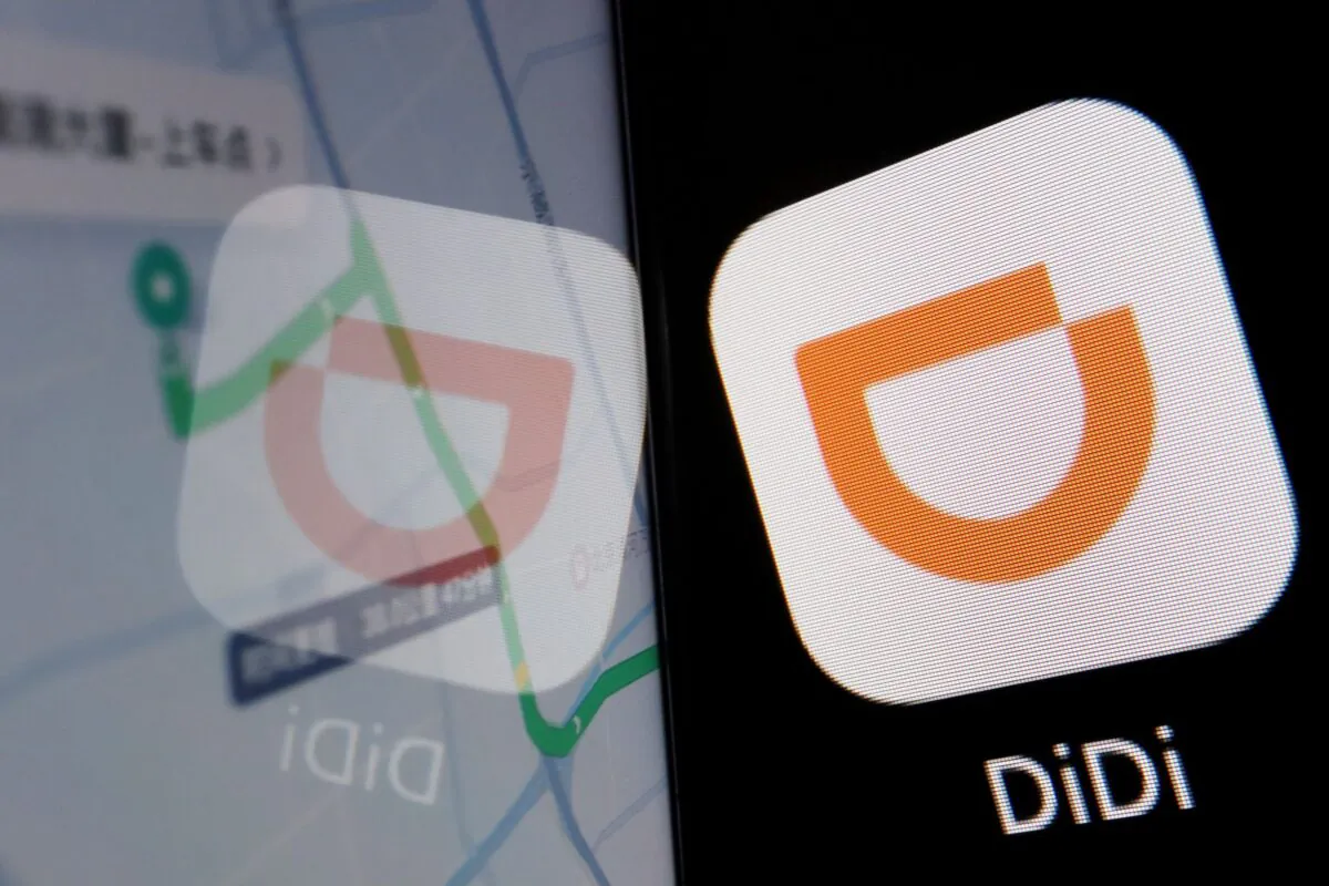 The app logo of Chinese ride-hailing giant Didi is seen reflected on its navigation map displayed on a mobile phone on July 1, 2021. (Reuters/Florence Lo/Illustration)
