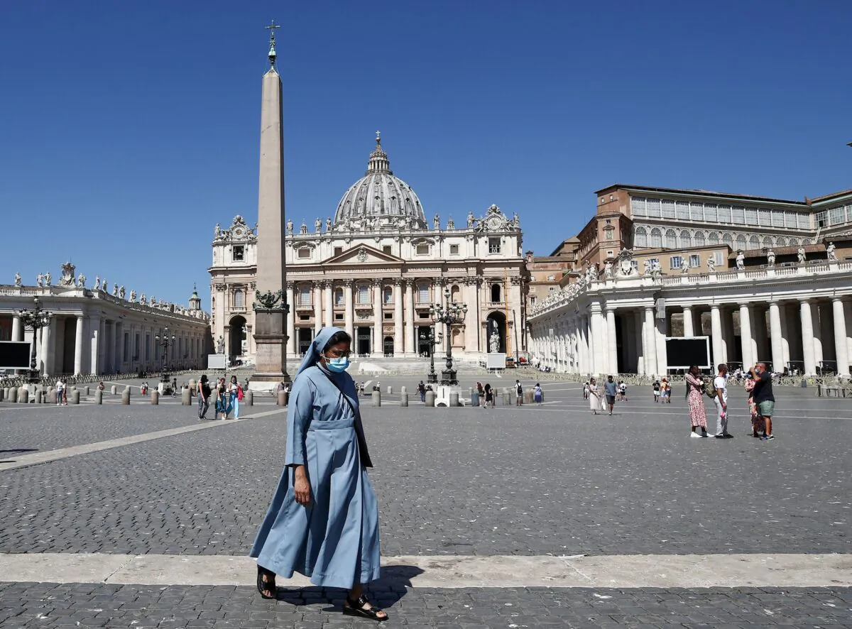 A nun walks across St. Peter's Square in Vatican City on July 6, 2021. (Isabella Bonotto/AFP via Getty Images)