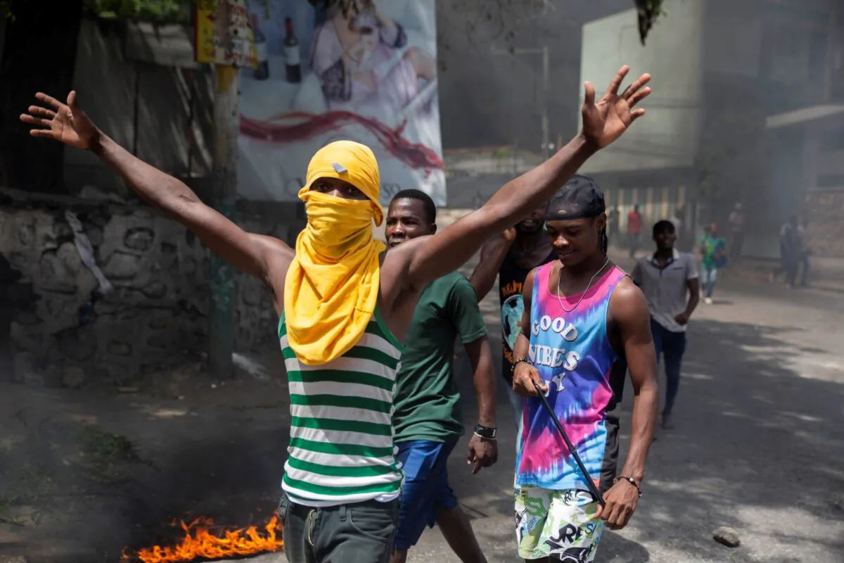 People protest against the assassination of Haitian President Jovenel Moïse near the police station of Petion Ville in Port-au-Prince, Haiti, on July 8, 2021. (Joseph Odelyn/AP Photo)