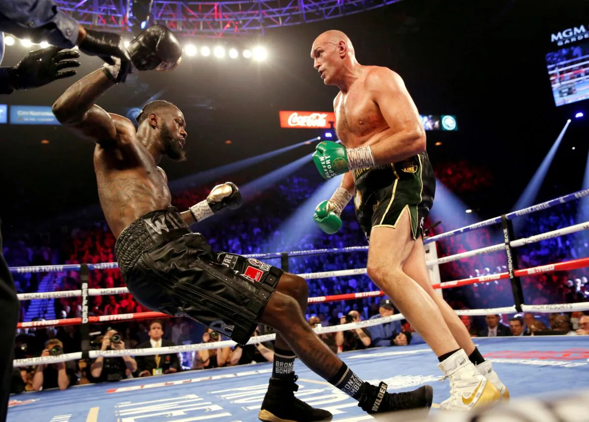 Tyson Fury knocks down Deontay Wilder during their Heavyweight bout for Wilder's WBC and Fury's lineal heavyweight title at MGM Grand Garden Arena in Las Vegas, Nev., on Feb. 22, 2020. (Steve Marcus/Reuters)