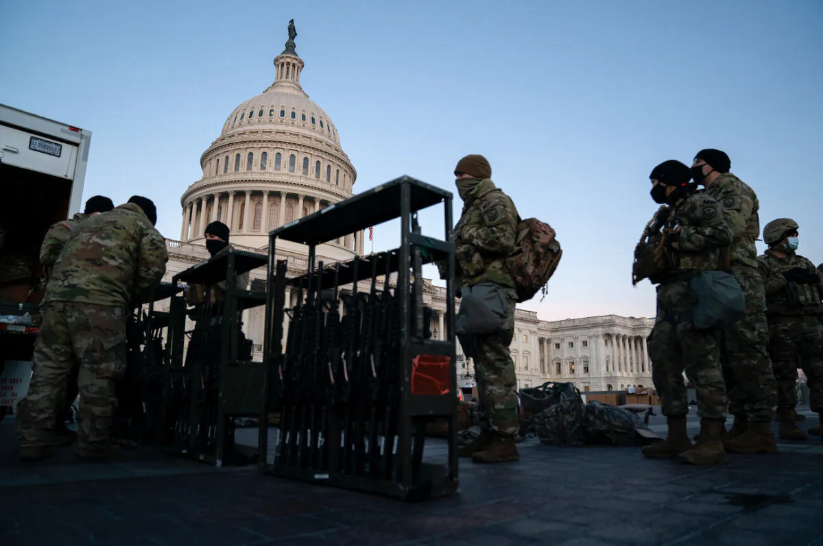 Weapons are distributed to members of the National Guard outside the U.S. Capitol in Washington, on Jan. 13, 2021. (Stefani Reynolds/Getty Images)