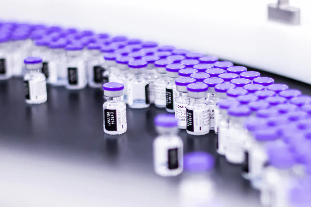Vials of the Pfizer-BioNTech COVID-19 vaccine are prepared for packaging at the company’s facility in Puurs, Belgium, in March 2021. (Pfizer via AP)