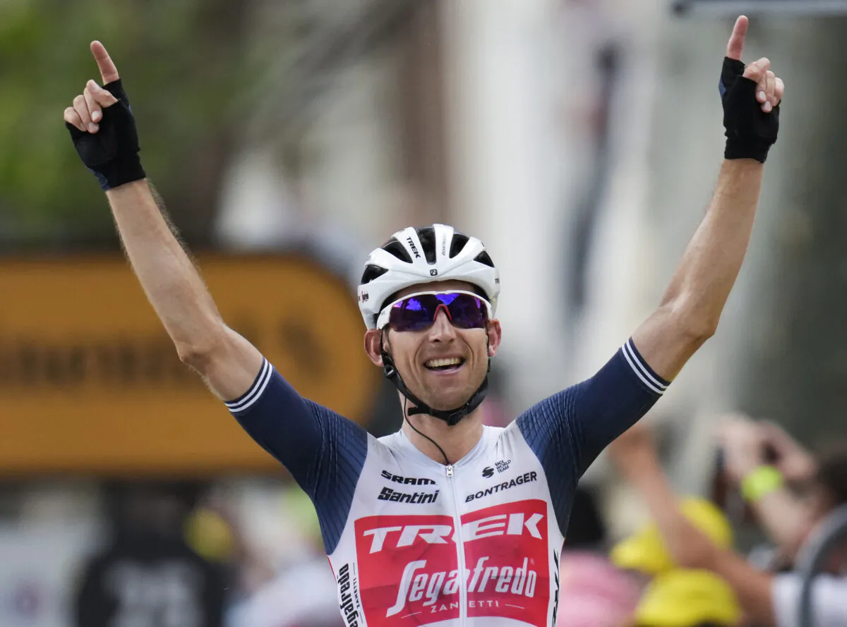 Netherland's Bauke Mollema crosses the finish line to win the fourteenth stage of the Tour de France cycling race, finishing in Quillan, France, on Saturday, July 10, 2021. (AP Photo/Daniel Cole)