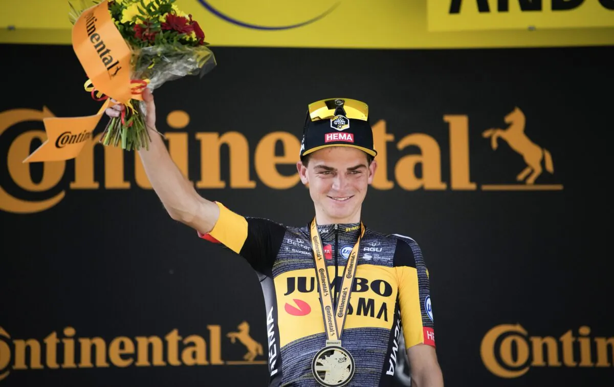 Sepp Kuss of the United States celebrates on the podium after winning the 15th stage of the Tour de France cycling race over 191.3 kilometers (118.9 miles) with start in Ceret and finish in Andorra-la-Vella, Andorra, on July 11, 2021. (Christophe Ena/AP Photo)