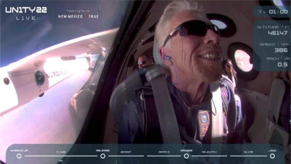 Branson smiles on board Virgin Galactic's passenger rocket plane