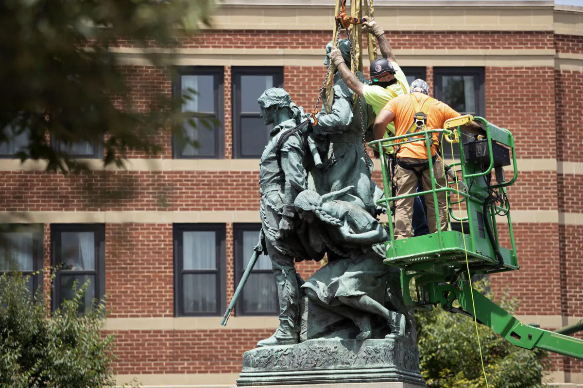 The statue of Meriwether Lewis, William Clark and Sacagawea is removed from Charlottesville, Va., on July 10, 2021. (Ryan M. Kelly/AFP via Getty Images)