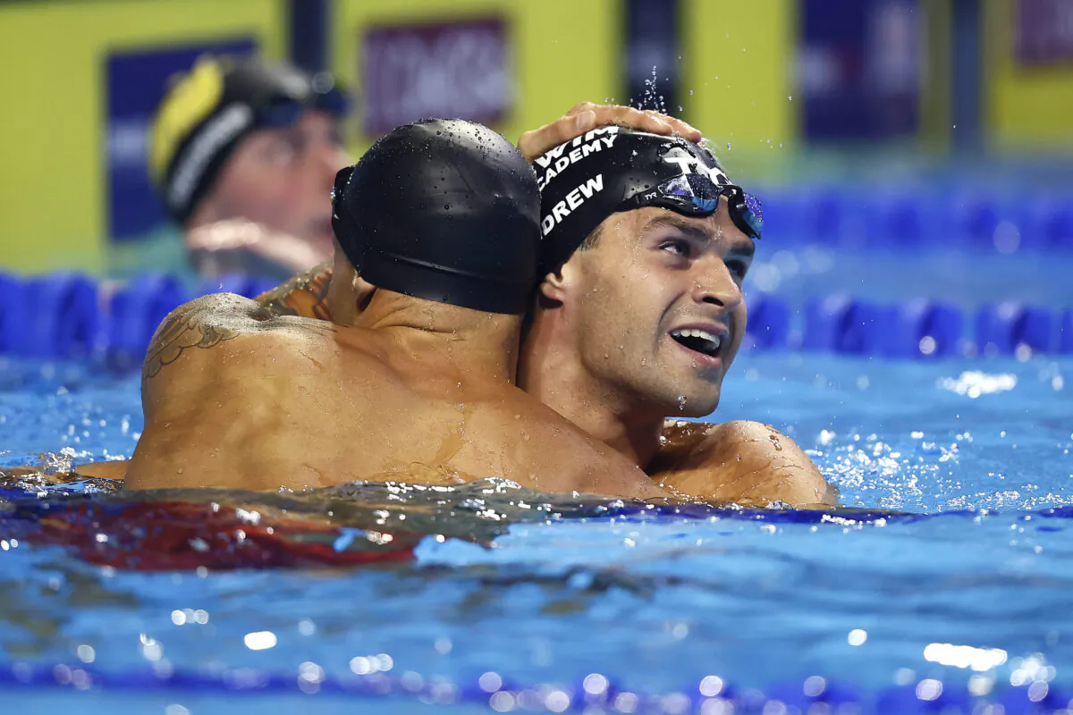 Caeleb Dressel and Michael Andrew of the United States react after competing in the Men's 50m freestyle final where Dressel set a new American Record during Day Eight of the 2021 U.S. Olympic Team Swimming Trials at CHI Health Center on June 20, 2021, in Omaha, Nebraska. (Tom Pennington/Getty Images)