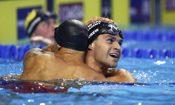 Caeleb Dressel and Michael Andrew of the United States react after competing in the Men's 50m freestyle final where Dressel set a new American Record during Day Eight of the 2021 U.S. Olympic Team Swimming Trials at CHI Health Center on June 20, 2021, in Omaha, Nebraska. (Tom Pennington/Getty Images)