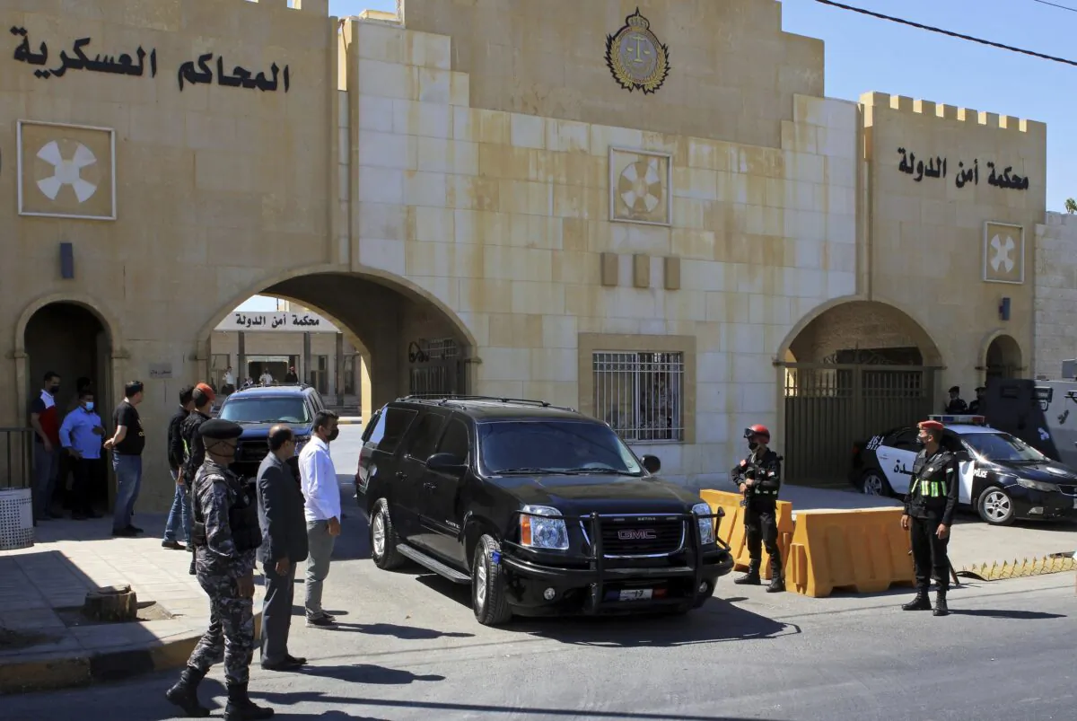 Bassem Awadallah, a former royal adviser, leaves a state security court in a vehicle after the first session of his closed-door trial, in Amman, Jordan, on June 21, 2021. (Raad Adayleh/AP Photo, File)