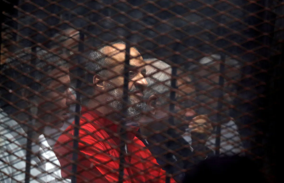 Muslim Brotherhood's senior member Mohamed El-Beltagi sits behind the bars during a court session in Cairo, Egypt, on Dec. 2, 2018. (Amr Abdallah Dalsh/File Photo/Reuters)