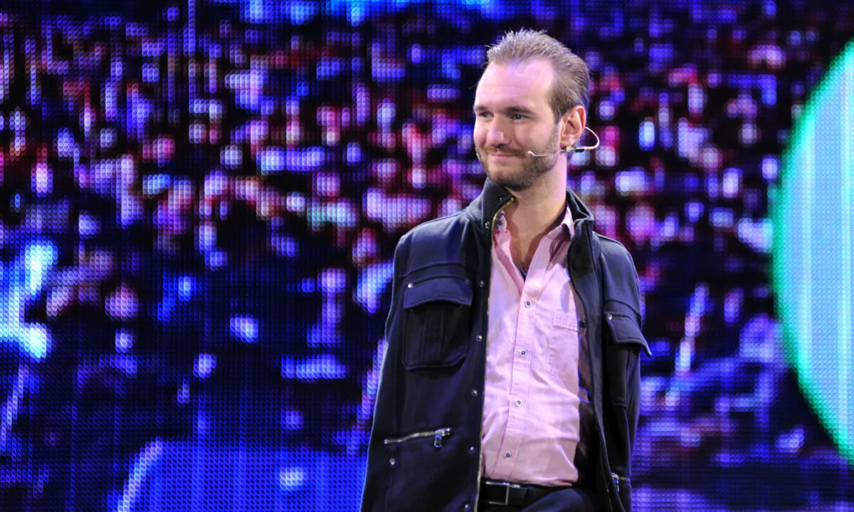 Australian motivational speaker Nick Vujicic delivers a speech to 50,000 spectators at the Taipei World Trade Center Nangang Exhibition Hall on Dec. 14, 2013. (Mandy Cheng/AFP via Getty Images)