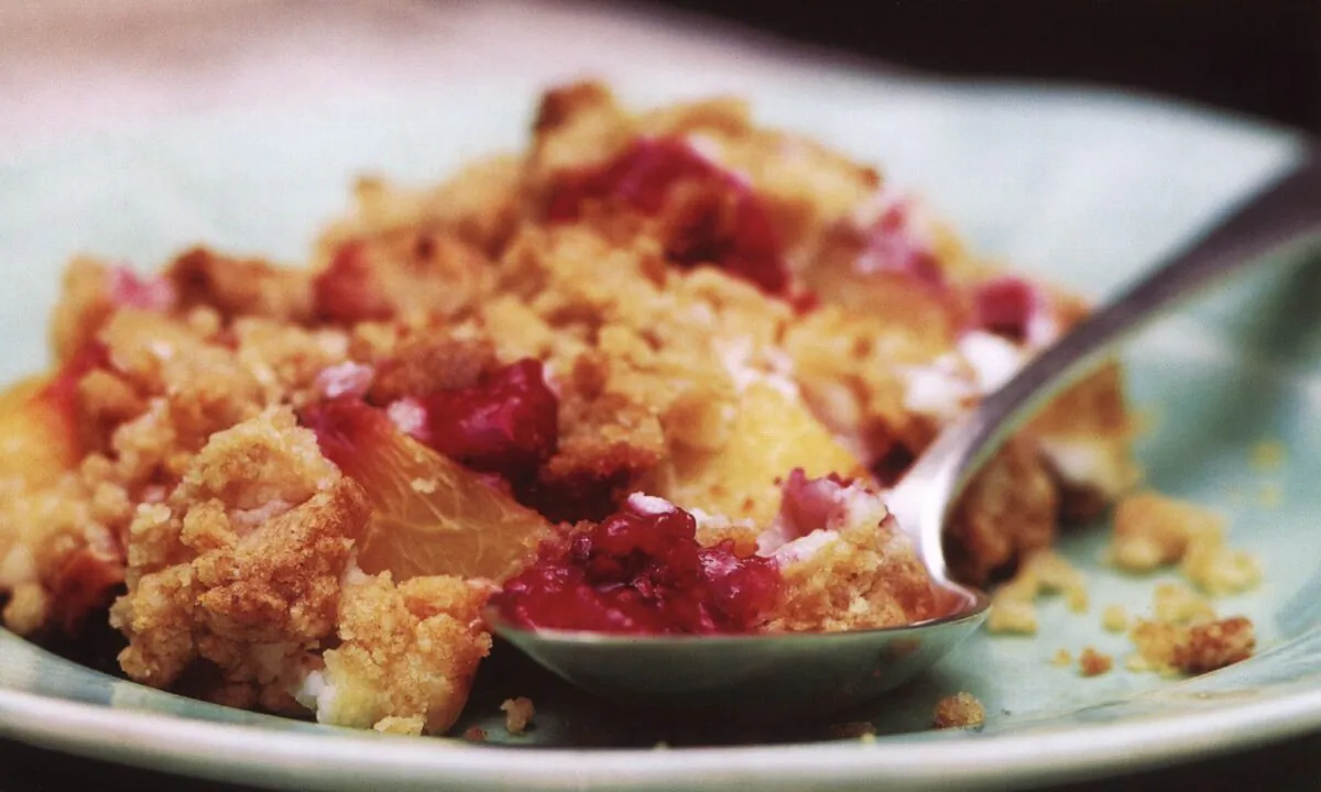 Juicy summer fruits, a creme fraiche custard filling, and a crisp, buttery crust combine in this crowd-pleasing dessert. (Noel Barnhurst/TNS)