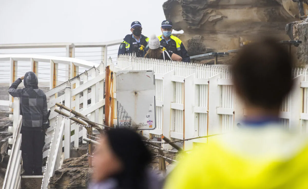 Police are seen patrolling Bronte Beach in Sydney, Australia, on July 10, 2021. Lockdown restrictions have been tightened across NSW as delta strain COVID-19 cases continue to be recorded in the community. (Jenny Evans/Getty Images)