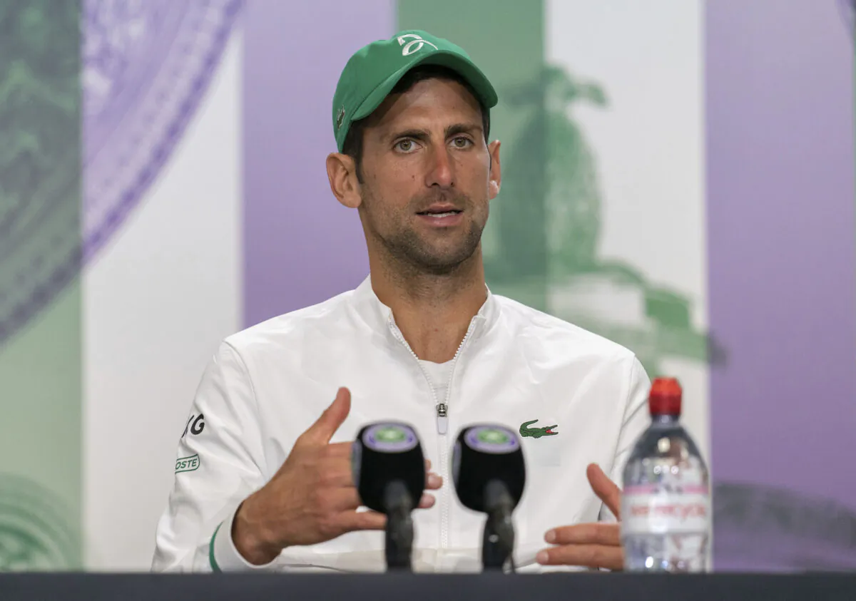 Novak Djokovic attends a press conference after winning the men's final against Italy's Matteo Berrettini at the Wimbledon Tennis Championships in London, on July 11, 2021. (Joe Toth/Pool via AP)
