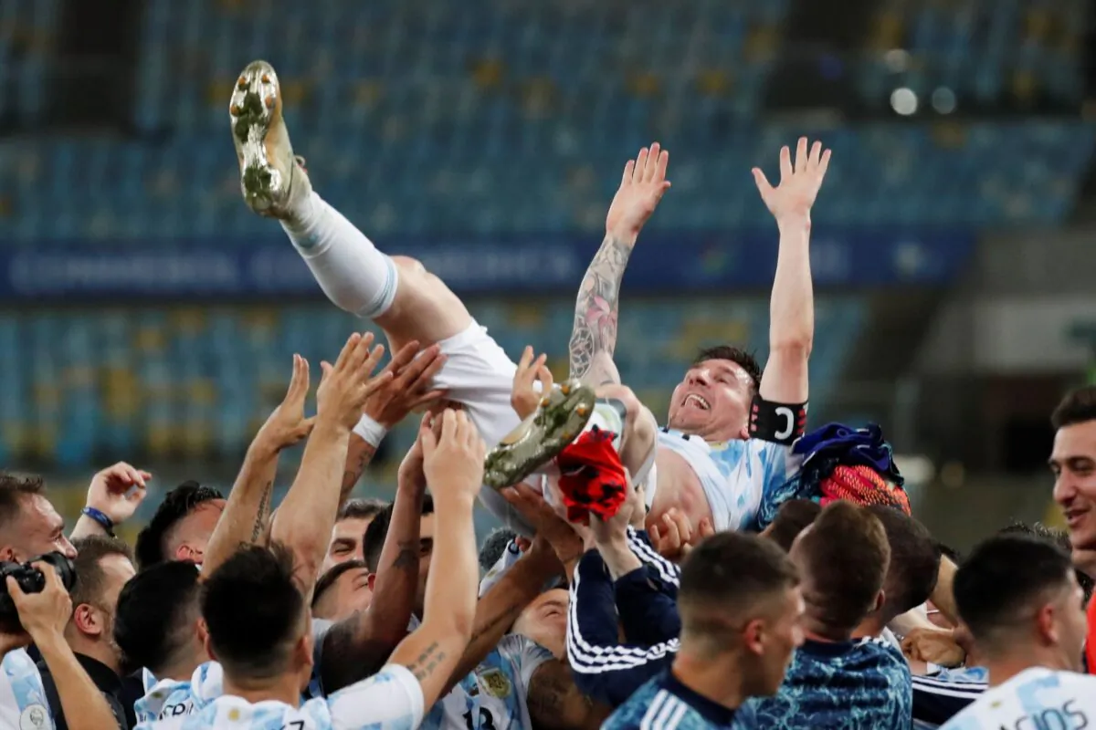 Teammates lift Argentina's Lionel Messi after beating Brazil 1-0 in the Copa America final soccer match at the Maracana stadium in Rio de Janeiro, Brazil, on July 10, 2021. (Bruna Prado/AP Photo)