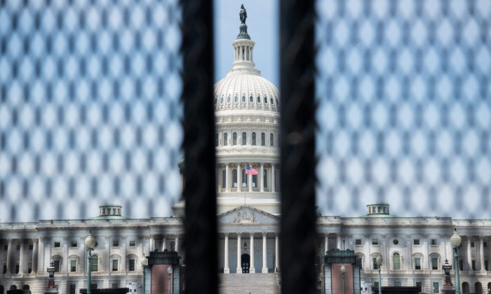 A tall security fence surrounds the U.S. Capitol ahead of President Joe Biden's address to a joint session of Congress in Washington, on April 28, 2021. (Saul Loeb/AFP via Getty Images)