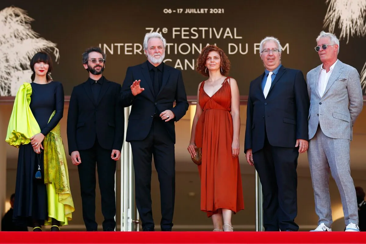 Director Ari Folman and cast members Karen O and Lena Guberman with composer Ben Goldwasser, producer Jani Thiltges, and a guest pose on the 74th Cannes Film Festival, in Cannes, France, on July 9, 2021. (Johanna Geron/Reuters)