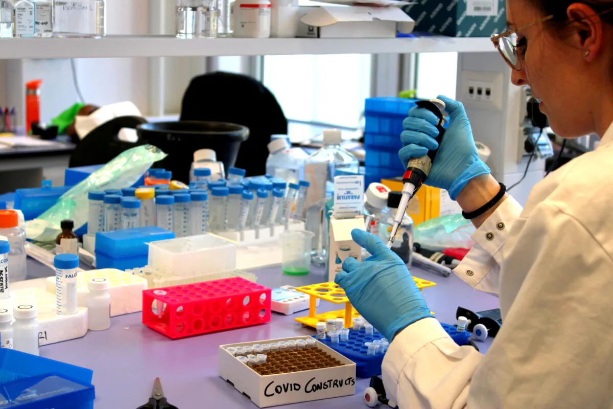 A researcher works inside a laboratory during the development of a vaccine in a file photo. (Reithera/Handout via Reuters)