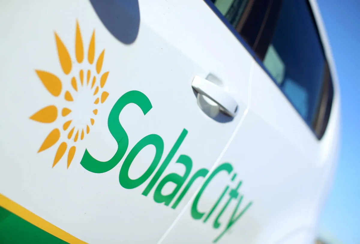 A Solar City logo is seen on the side of a company vehicle in San Diego, Calif., on Nov. 2, 2016. (Mike Blake/Reuters)