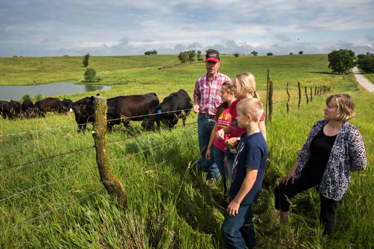 Cattle farmer Rod Christen (L) with family at his farm in southern Nebraska on June 25, 2021. (Petr Svab/The Epoch Times)