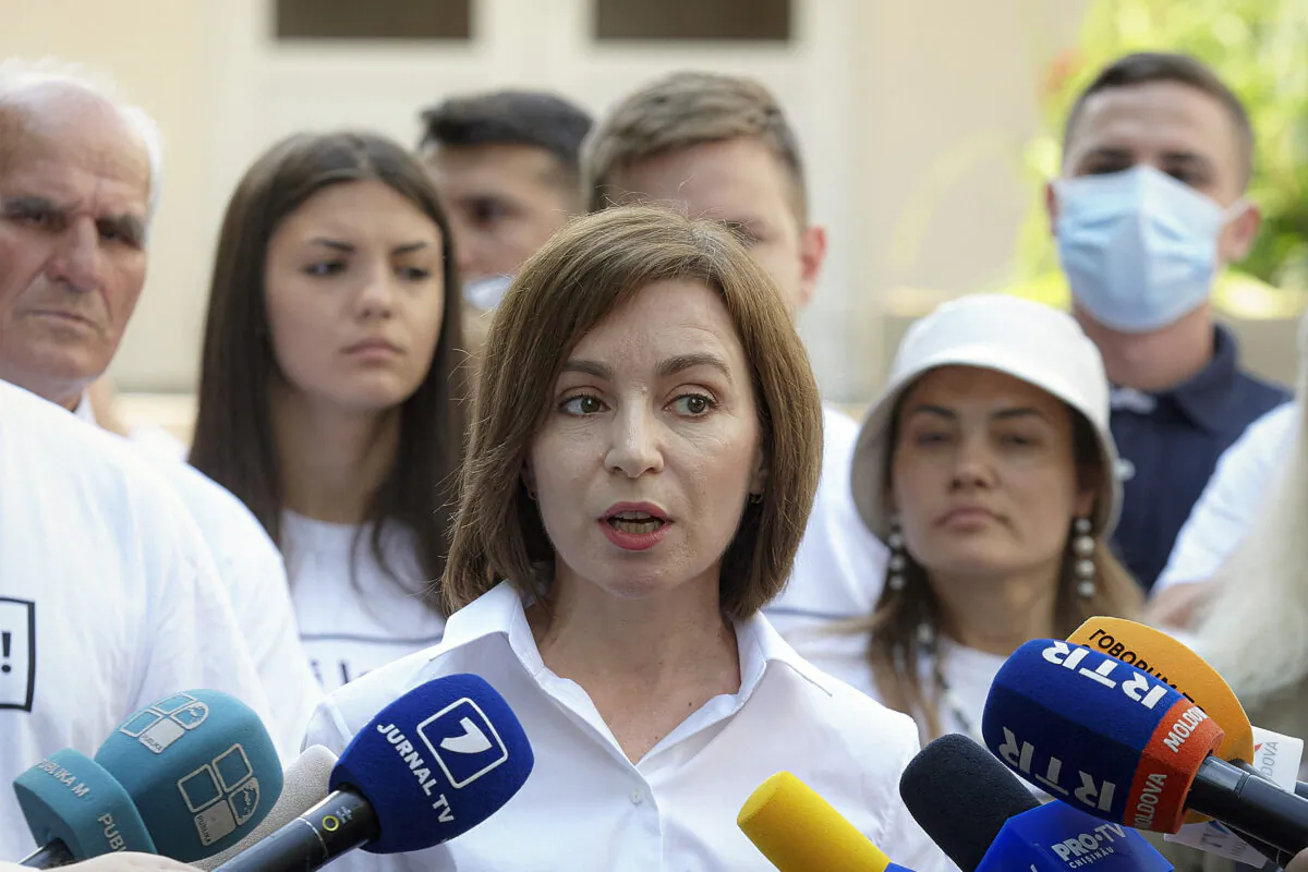 Moldova's President Maia Sandu speaks to the media after casting her vote in a snap parliamentary election, in Chisinau, Moldova, on July 11, 2021. (Aurel Obreja/AP Photo)