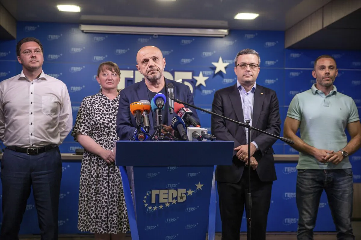 Former Deputy Prime Minister Tomislav Donchev (C) and GERB political party officials attend a news conference in capital Sofia, Bulgaria, on July 11, 2021. (Visar Kryeziu/AP Photo)
