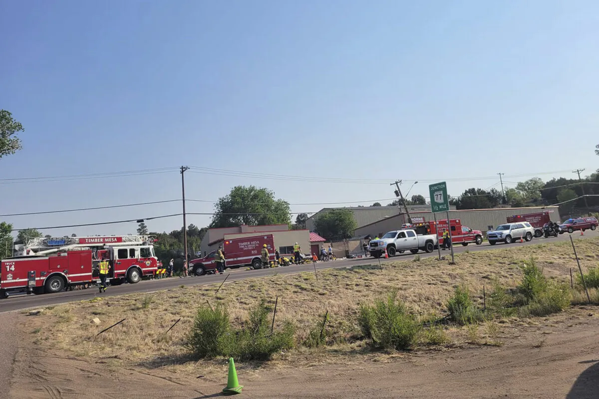 Timber Mesa Fire and Medical District emergency personnel gather at the scene of a mass casualty incident near Downtown 9 in Show Low, Ariz., on June 19, 2021. (Timber Mesa Fire and Medical District/File via AP)