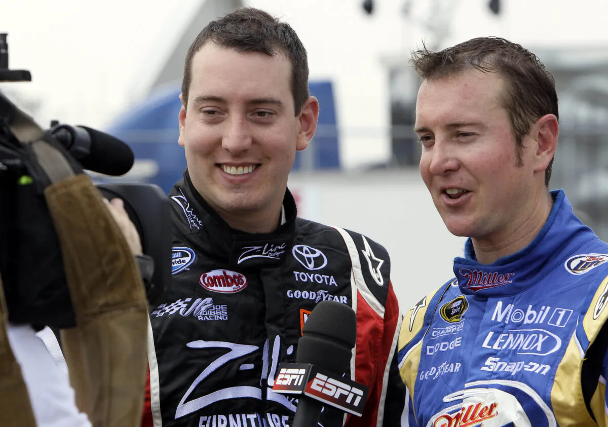 Drivers Kyle Busch (L) and Kurt Busch (R) speak to reporters during practice for a NASCAR Sprint Cup Series auto race in Darlington, S.C., on May 7, 2010. (Gerry Broome/AP Photo)