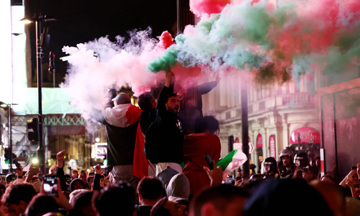Italy fans celebrate after winning the Euro 2020 in London on July 12, 2021. (Henry Nicholls/Reuters)