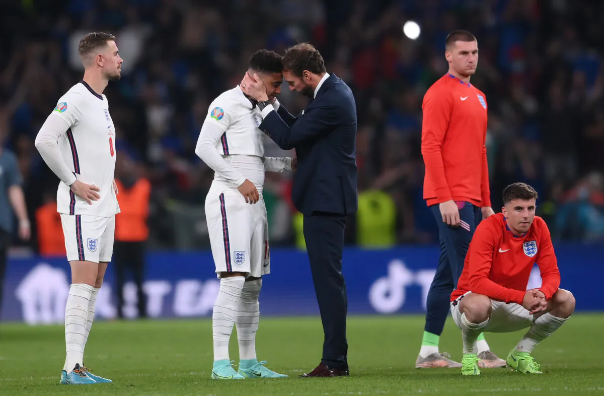 Gareth Southgate, Head Coach of England consoles Jadon Sancho following defeat in the UEFA Euro 2020 Championship Final between Italy and England at Wembley Stadium, London on July 11, 2021. (Laurence Griffiths/Getty Images)