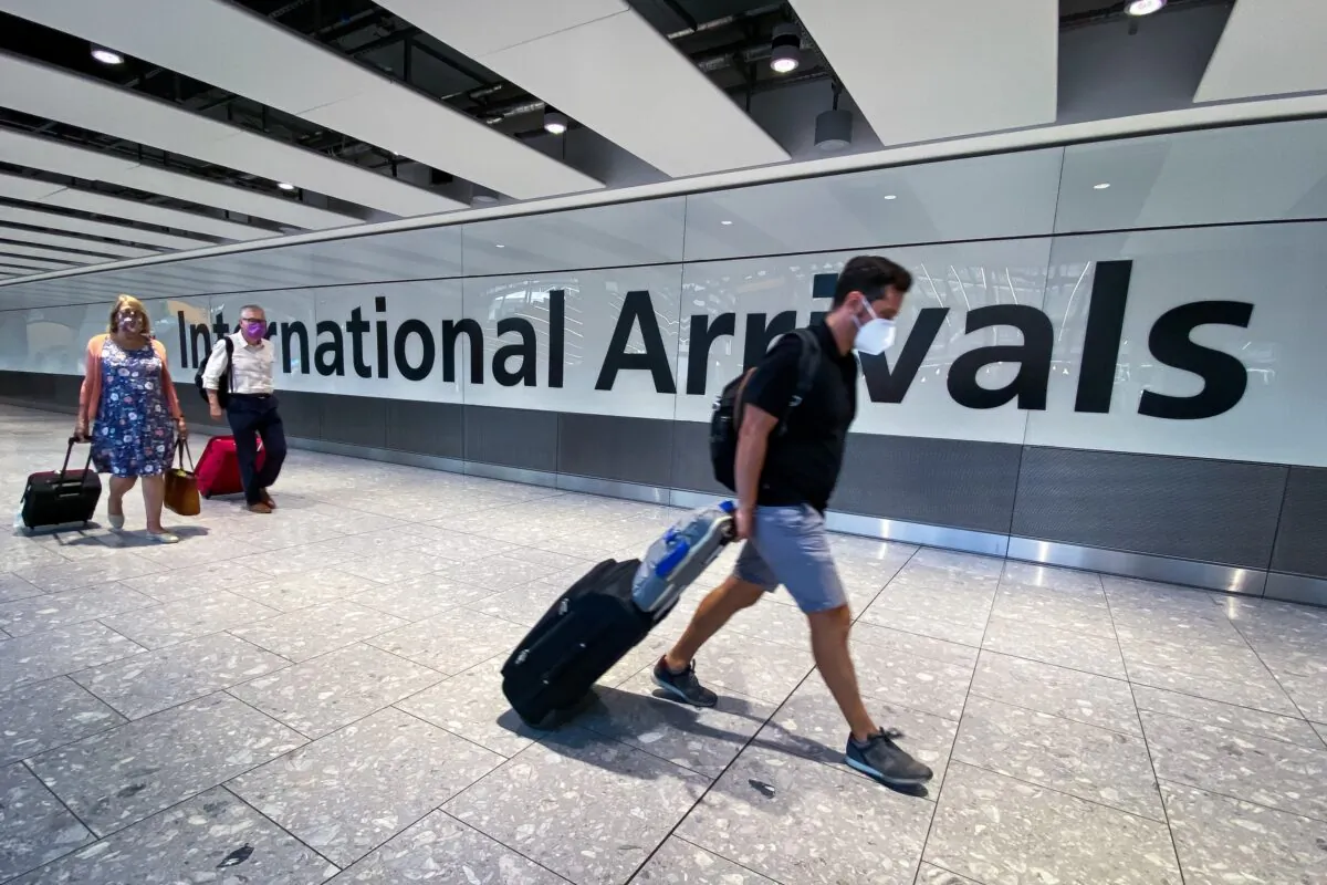 Passengers in the arrivals hall at Heathrow Airport, London, on Aug. 22, 2020. (Aaron Chown/PA)